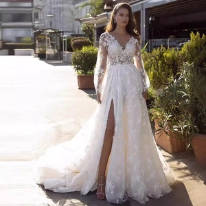 Elegant white lace mermaid wedding dress with deep V-neck and long floral train