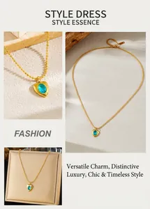 Detail of gold bead chain necklace with blue gemstone heart pendant in gift box display