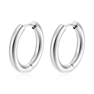 Close-up of polished silver stainless steel hoop earrings with hinged clasps for unisex