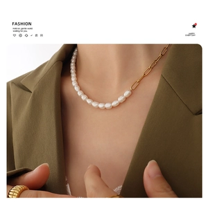 Detail view of freshwater pearl and 18K gold plated titanium steel splice necklace