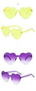 Detail shots of yellow and gradient purple heart-shaped rimless sunglasses at 45-degree angle
