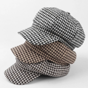 Classic houndstooth octagonal newsboy hats in black, brown, and grey patterns