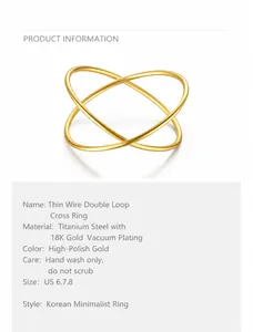 Detail of thin line cross ring in 18K gold plated titanium steel showing polished finish
