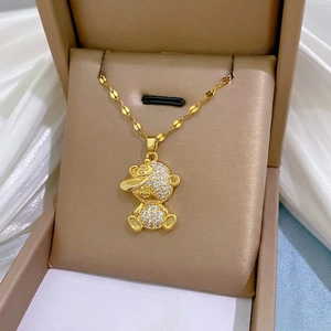 Chic gold titanium steel necklace with a glittering rhinestone boy pendant on white silk