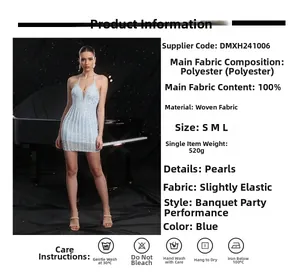 Detail view of light blue mini dress with pearl beads and deep V-neck halter design