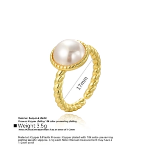 Close-up of vintage 18k gold plated twist ring featuring a large white baroque pearl