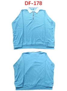 Detail of light blue waffle knit fabric on polo shirt with white contrast collar and zipper