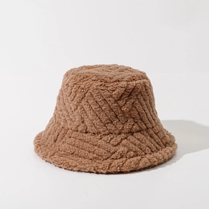 Detailed view of the striped lamb wool texture on this warm brown winter bucket hat