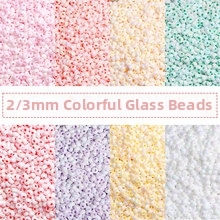 Detailed grid view of 2mm and 3mm colorful glass seed beads for DIY jewelry making