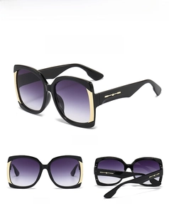 Detailed views of square black oversized sunglasses with golden metal arrow hinges and gradient lenses
