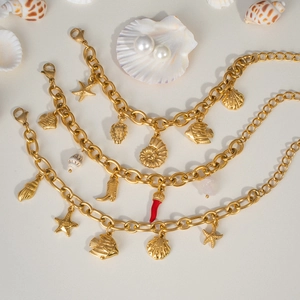 Gold ocean themed multi-layer bracelet set with starfish and shell charms