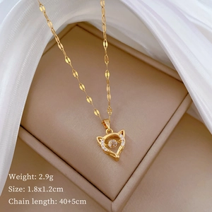Detailed view of fox pendant necklace in a warm gift box with silk fabric padding