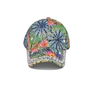 Close-up of vibrant floral print baseball cap with sparkling rhinestones and lace detail