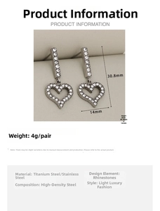 Detailed view of heart-shaped dangling earrings with dimensions 30.8mm by 14mm
