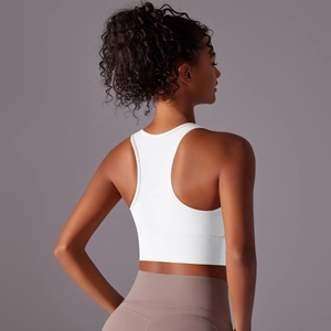Detail of the white racerback sports bra showing ergonomic design and back support