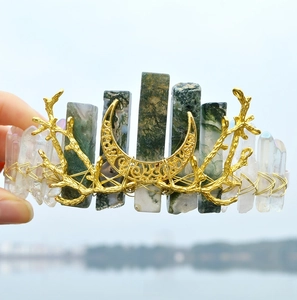 Detail of handmade crystal crown with gold moon, branches, and wire-wrapped moss agate