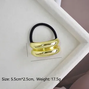 Close-up of gold U-shaped double-layered hair tie with size 5.5cm x 2.5cm and 17.5g weight