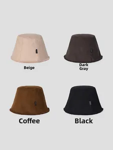 Detail showing fringed bucket hats in beige, dark grey, coffee and black colors