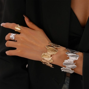 Two-piece textured metal leaf open bangle set in gold and silver finish for women