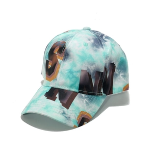 Detail of blue and white tie-dye baseball cap with 3D textured letter embroidery