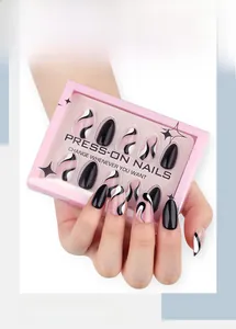 Short almond press-on nails featuring solid black and swirl patterns in pink box packaging