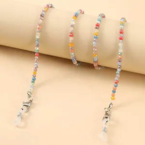 Macro shot of colorful faceted crystal beads eyewear chain with silver lobster clasps
