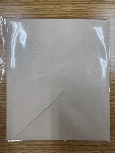White square envelope made of shimmering specialty paper in protective OPP packaging