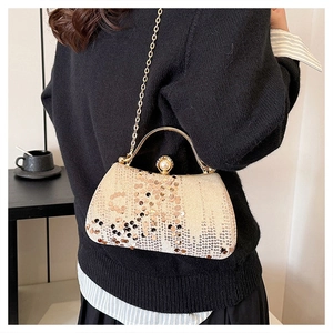 Elegant champagne sequin clutch bag with pearl clasp and golden metal handle