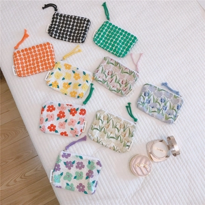 Detailed assortment of floral cotton mini pouches with simple wish brand woven labels