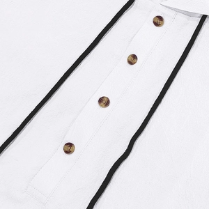 Close-up of white linen shirt featuring textured fabric and tortoiseshell buttons