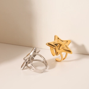 Polished stainless steel star rings in gold and silver with adjustable open design