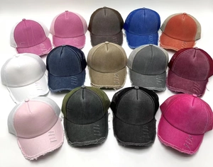 Grid view of 13 colorful distressed trucker hats with breathable mesh and ripped denim details