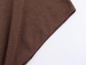 Close-up of high-quality fine knit texture and neckline finish in caramel brown color