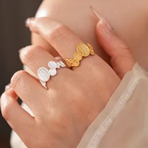 Minimalist textured oval disc open ring in gold and silver finish with hammer pattern
