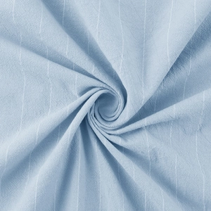 Detail of light blue striped linen fabric showing texture and natural drape quality