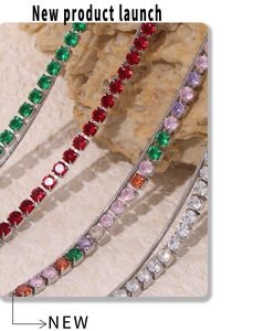 Macro shot of 18K gold plated multi-color zircon pendant necklace set on stone background