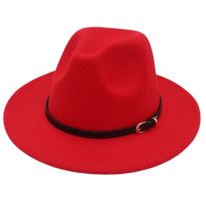 Detailed view of a red wool jazz hat featuring a black belt strap and gold metal buckle