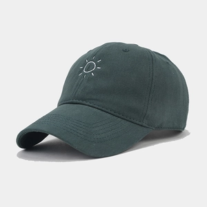 Detailed side view of dark green baseball cap with white sun embroidery and cotton texture