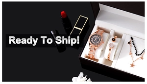 Close-up of rose gold iced-out watch and jewelry set in a premium padded gift box