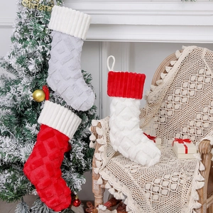Plush Christmas stocking set with diamond pattern hanging on a decorated tree