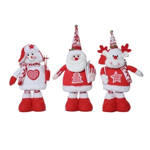 Three Christmas plush dolls including Santa, snowman and reindeer on a white background