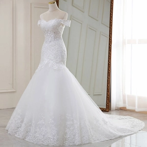 Elegant off-shoulder white lace mermaid wedding dress with a long ethereal train