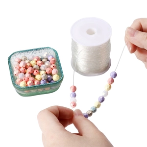 DIY jewelry making kit with colorful faceted beads and clear elastic crystal string