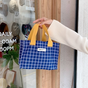 Blue plaid canvas lunch bag with yellow handles and Korean text patch detail