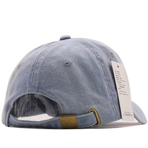 Detail of light blue denim baseball cap with adjustable bronze metal buckle and eyelets