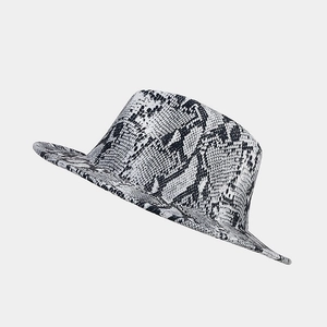 Detailed view of bold black and white snakeskin print on a wool fedora hat