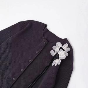 Women's dark purple ribbed knit cardigan featuring 3D white organza flower detail