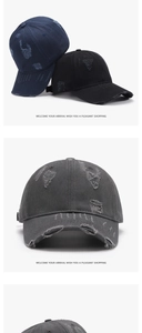 Detailed view of distressed baseball caps in navy, black and grey with vintage worn-out holes