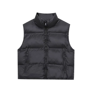 Detail of waterproof quilted puffer vest featuring high collar and secure zip pockets