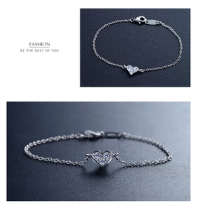 Macro detail of S925 sterling silver heart bracelet with sparkling cubic zirconia pavé
